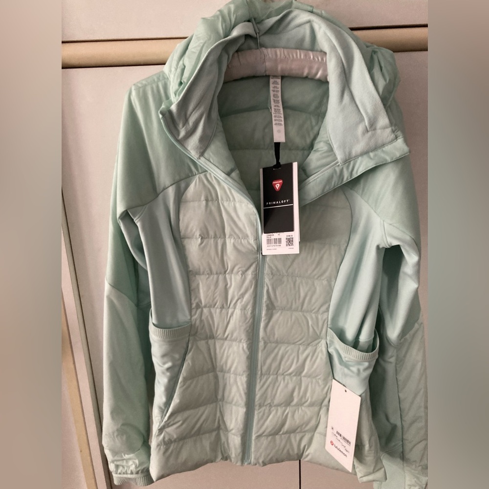 Lululemon lightweight down athletic jacket. Great 3 season jacket. Mint Size 10.